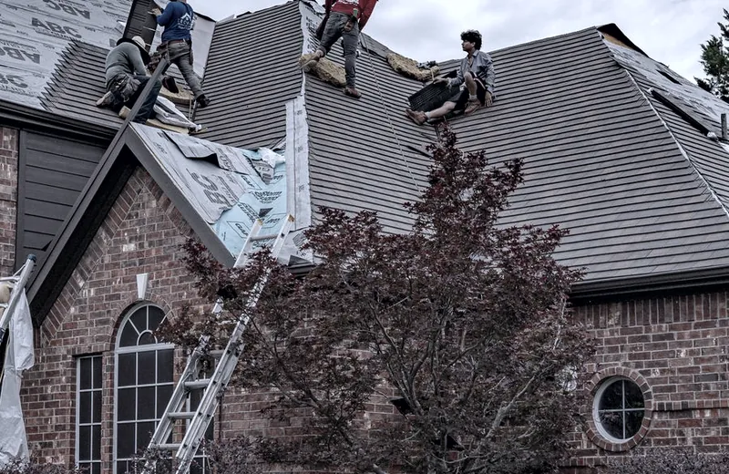 A technician working on a residential roof